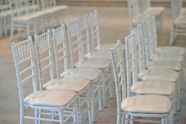 Row of Chiavari chairs with cushioned seats